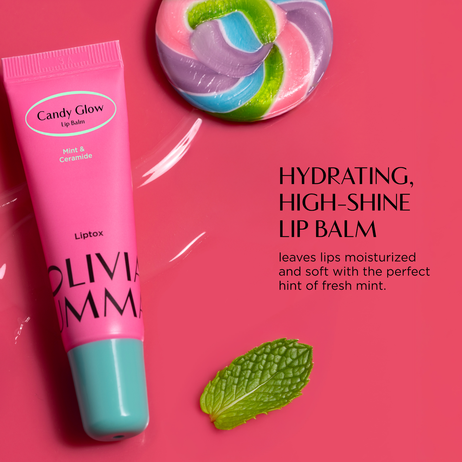 Pink lip balm tube with green leaf on a pink background