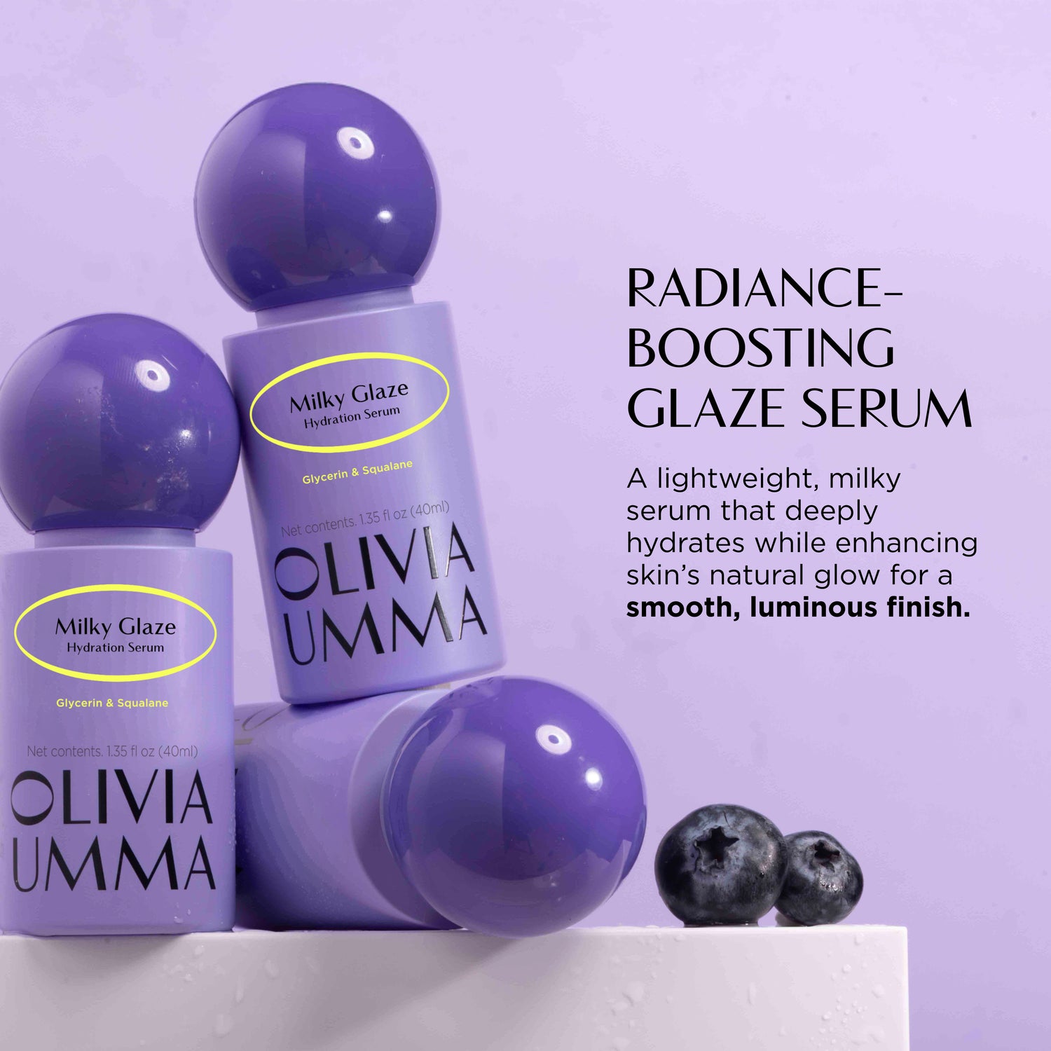 Olivia Umma Milky Glaze Hydration Serum with purple bottles on a light purple background