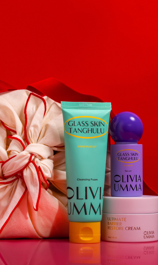 Skincare products with 'OLIVIAUMMA' branding on a red background