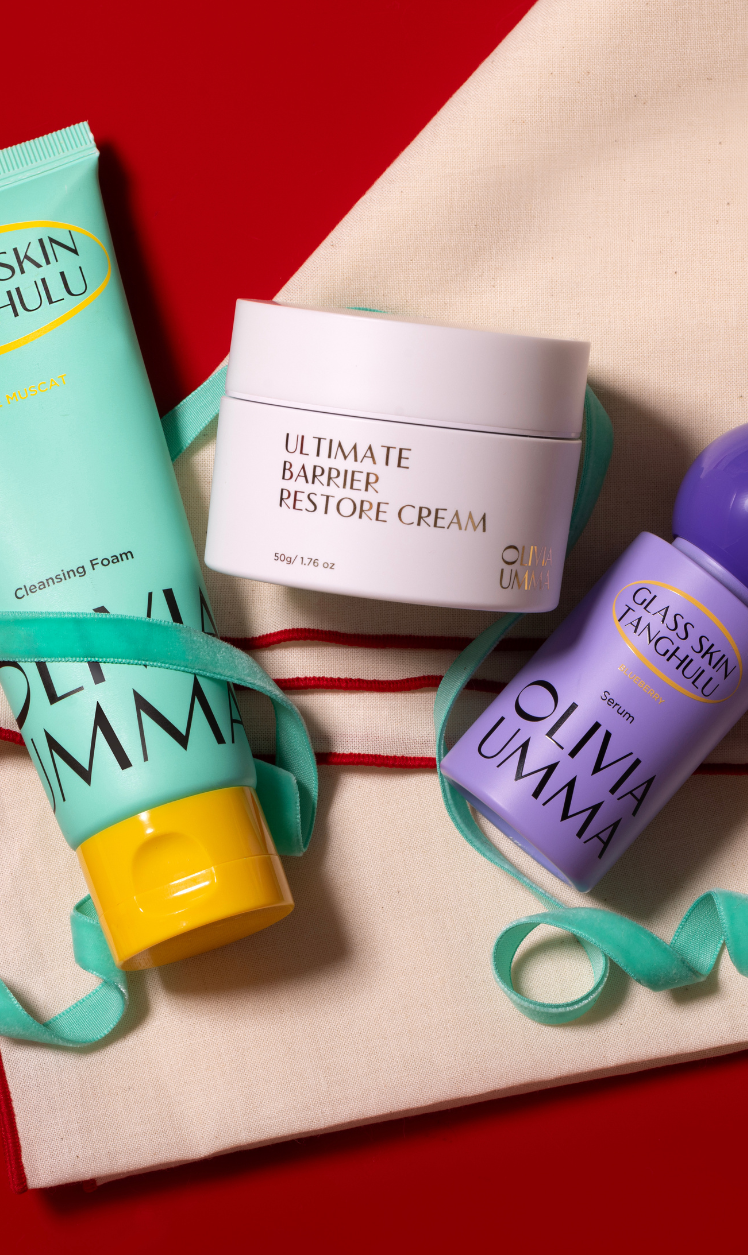 Three skincare products from Olivia Umma on a red background