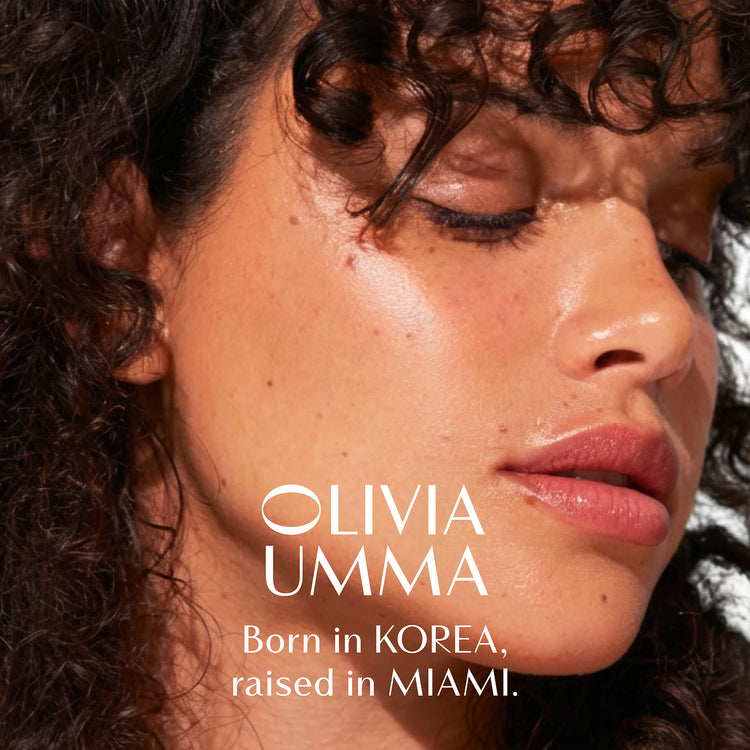 Close-up of a woman's face with 'Olivia Umma' text about her origin.