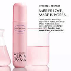 Olivia Umma PDRN Skin Toning Mist in a light pink bottle, shown alongside two glass beakers containing pink liquid on a white background with Barrier love, Made in Korea.