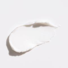 White cream swatch on a light gray background