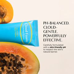 Cloud Foam tube with a halved papaya on a light background