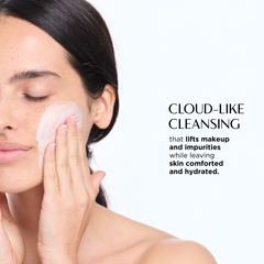 Woman applying cloud-like cleansing product to face with text about its benefits.