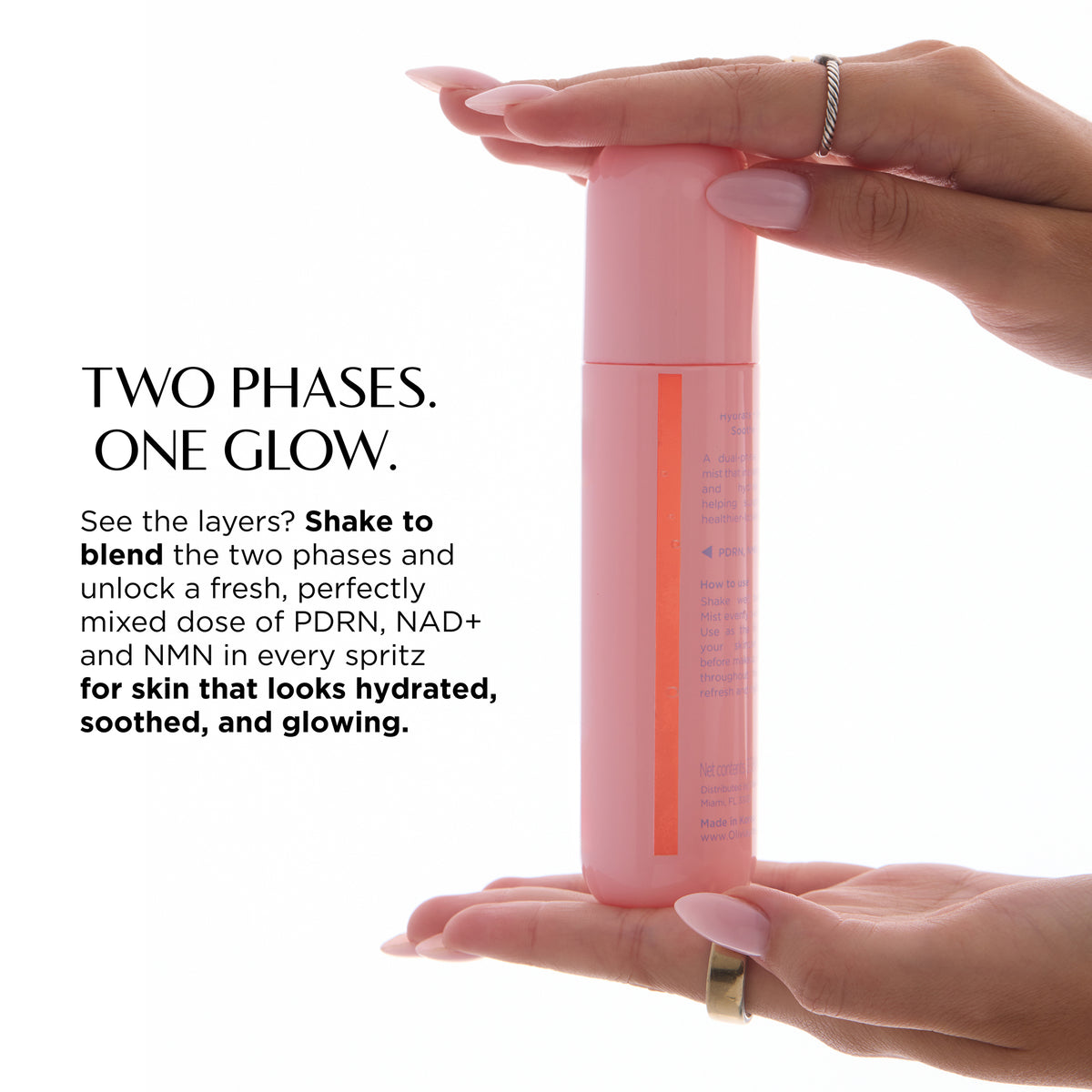 A PDRN Skin Toning Mist held between two hands against a white background, with promotional text on the left reading 'TWO PHASES. ONE GLOW.