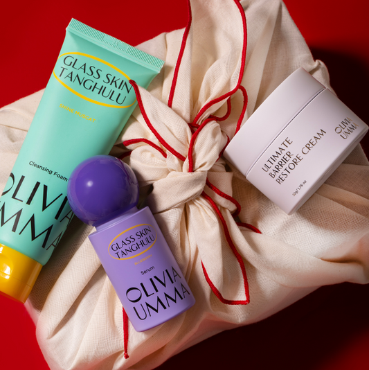 Three skincare products from Oliva umma red background