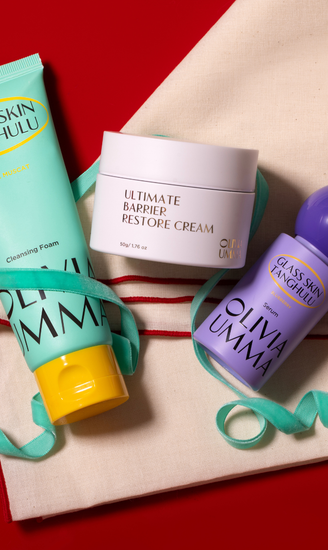 Three skincare products from Olivia Umma on a red background