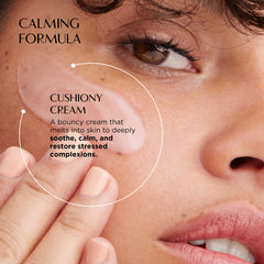 Close-up of a person applying cushiony cream to their skin with text about the calming formula.