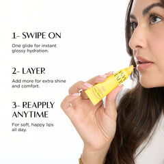 Woman applying yellow lip balm with usage instructions on a white background