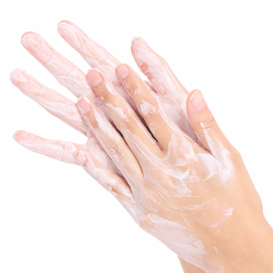 Hands with a Cashmere Whip Clarifying Cleanser application on a white background